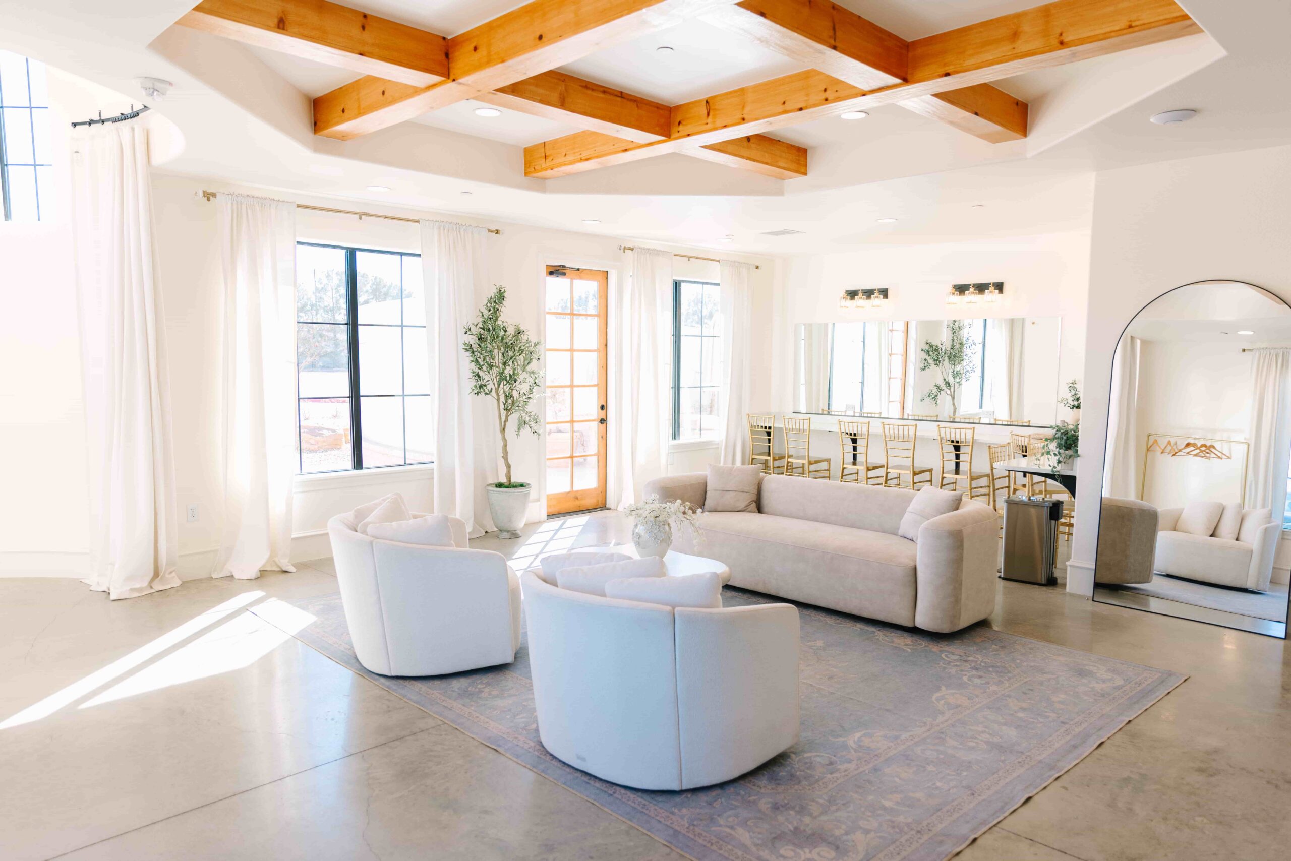 Interior photo of the Bridal Suite at Adelphos Cellars, including large vanity with mirrors and lounge seating